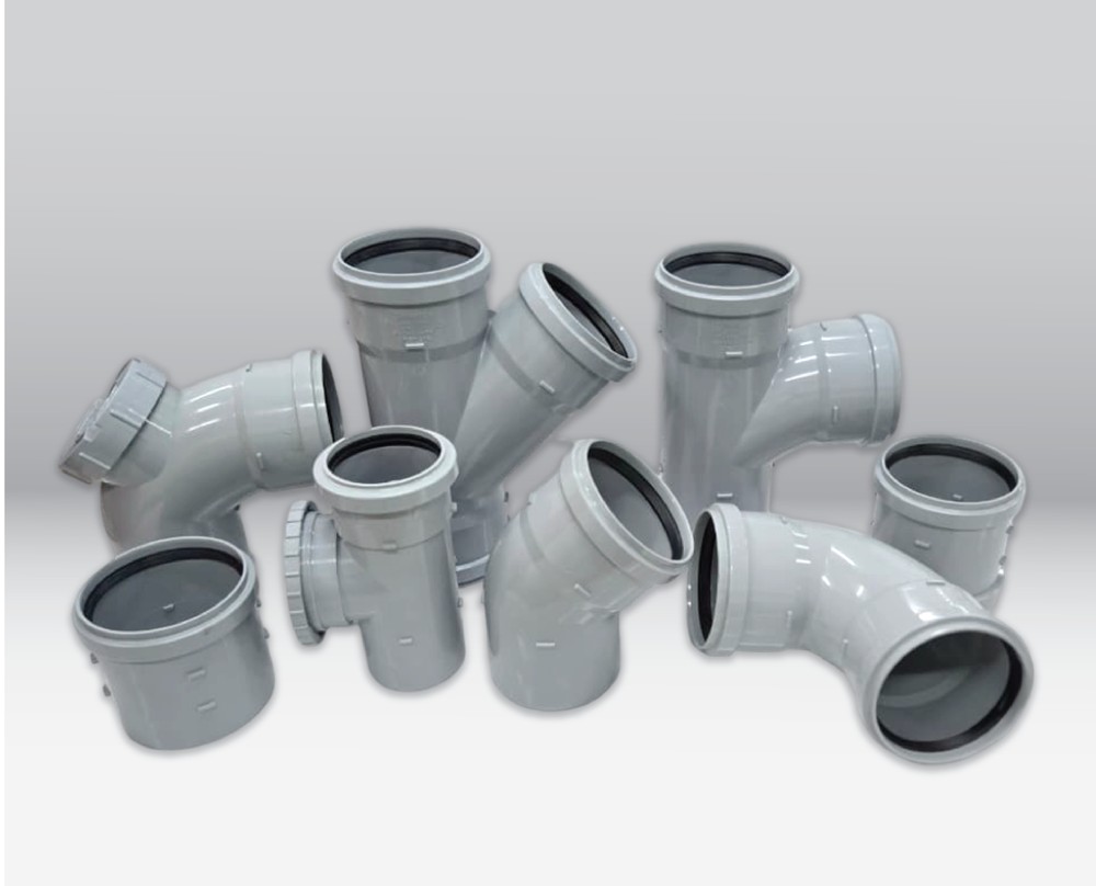 Marley PVC-U push-fit soil fittings — ring-seal bends, branches and boss connections in light grey